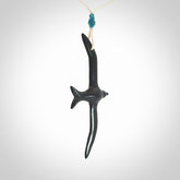 Hand carved black jade petrel bird pendant. Made by NZ Pacific, unique jewellery for sale online. Black Jade petrel bird necklaces with adjustable cords. Delivered with express courier and packaged in a woven kete pouch.